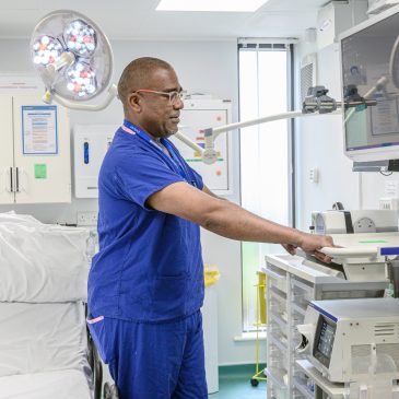 A nurse operates scanning equipment in the Endocrinology Department