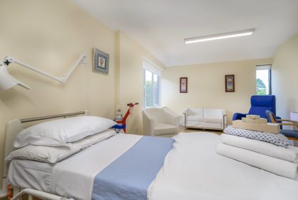 A private hospital room with fresh towels and gown