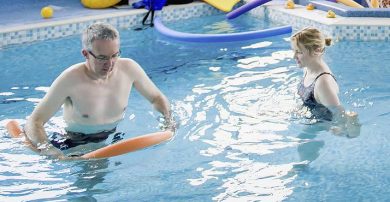Physio and patient in hydrotherapy pool