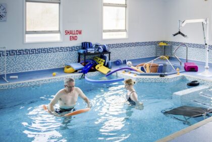 Patient and therapist in hydrotherapy pool