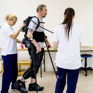 Patient walking using full height exoskeleton