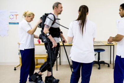 Patient walking using full height exoskeleton