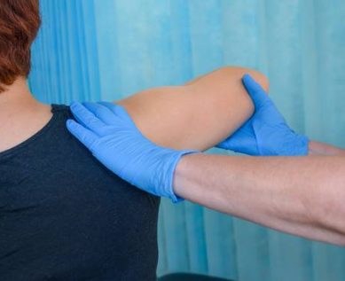 Physio working on patient's shoulder