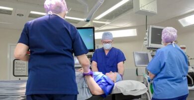 Surgical team in theatre with patient