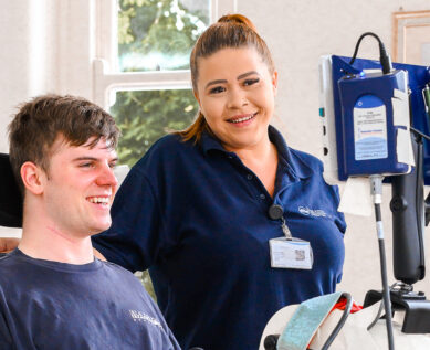 physiotherapist with spinal rehab patient
